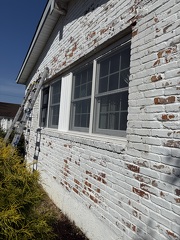 Paint Brick Siding while working 