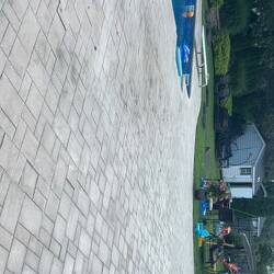 spreading polymeric sand on pavers